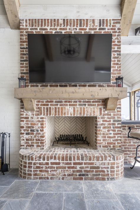 We love this outdoor space by Bishop Hearth & Home! Austin Interior Design, Brick Room, Brick Hearth, Indoor Outdoor Fireplaces, Screened Porch Designs, Outdoor Fireplace Designs, White Marble Tiles, Hearth Room, Hearth And Home