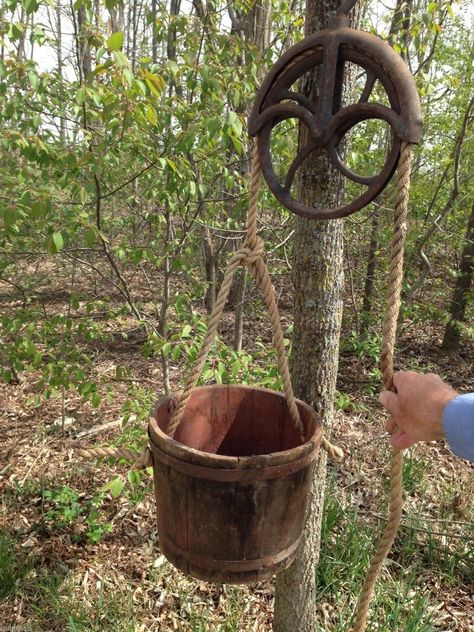 Water Well Pulley Wood Bucket Treehouse Bucket Pulley, Viking Battlefield, Pulley Ideas, Antique Pulley, Old Water Pumps, Wood Bucket, Bucket Flower, Pulley Light, Ranch Cabin