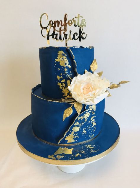 Comfort, 2 tier royal blue and gold theme wedding cake with statement sugar peony spray and personalised topper Lobola Cake Ideas, Royal Blue And Gold Cake, Blue And Gold Wedding Cake, Gold Theme Wedding, Royal Blue Wedding Cakes, Royal Blue Cake, Art Deco Wedding Cake, Blue And Gold Wedding, Blue Birthday Cakes