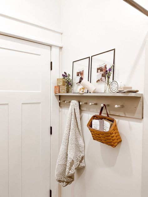 Looking for wall hook ideas for your home? Why not try a peg rail shelf! Add character and utilitarian storage to your bathroom, entryway, or laundry room with a DIY shaker style peg hook shelf. Read this post for a step by step guide on how to build a peg rail shelf in your home, inspiration pics of the peg rail in our bathroom, sources, paint colors, and more! Wall Hook Ideas, Peg Rail Shelf, Rail Shelf, Hook Ideas, Hook Shelf, Peg Wall, Peg Rail, Floating Picture Frames, Shaker Pegs