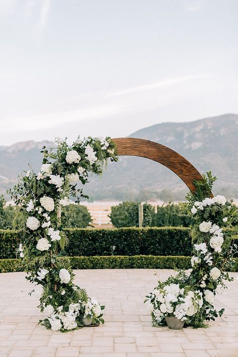 At a time when “pushing the envelope” and “thinking outside of the box” has become the trend, this photo shoot features the timeless elegance of a classic wedding. Wedding Arch Ideas, Circle Backdrop, Wedding Alters, Arch Ideas, Wedding Ceremony Ideas, Wedding Arbour, Wedding Altars, Arch Decoration Wedding, Ceremony Arch