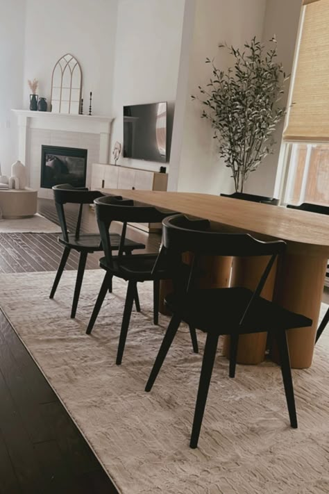 Modern Black Dining Table Wood, Brown Wood Table With Black Chairs, Light Wood Dining Table Dark Floors, Black And Brown Dining Room Decor, Dark Floors Dining Room Table, Rug For Dark Floors, Dining Table On Dark Wood Floor, Black And Tan Dining Room Decor, Black Floor Dining Room