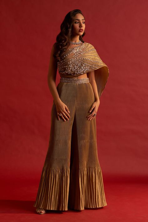 Shop for these amazing collections of Gold Pleated Silk Taffeta Embroidery Zardozi Asymmetric Tawny Jumpsuit For Women by Reeti Arneja online at Aza Fashions. Evening Party Wear Silk Sets, Evening Party Wear Tissue Silk Sets, Evening Party Wear Sets In Tissue Silk, Evening Party Silk Set, One Shoulder Embroidered Festive Sets, One-shoulder Embroidered Festive Sets, One-shoulder Embroidered Party Set, One Shoulder Embroidered Party Set, Party Sets With Gold Embroidery