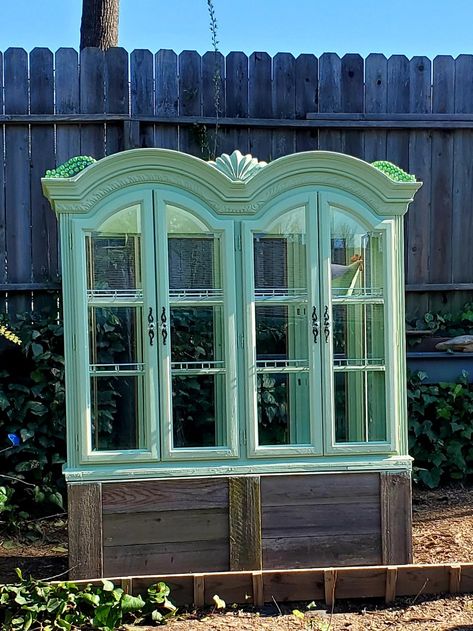 This mini green house was made from 2 separate China Cabinets. I built the planter box below and added the tops. I framed in the gaps, sealed, siliconed, painted, painted, and painted again Curio Greenhouse, China Cabinet Greenhouse, Mini Green House, Garden Gate Decor, Diy Container Gardening, Plant Display Ideas, Berry Garden, Green House Design, Outdoor Greenhouse