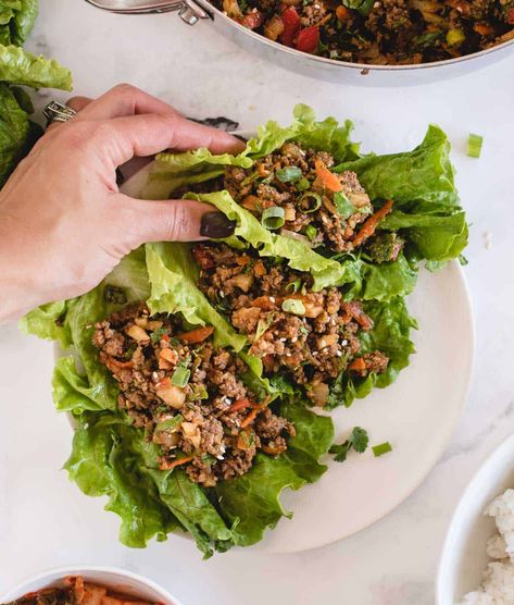 These quick-to-make ground beef lettuce wraps are loaded with savory ground beef and veggies doused in an umami-rich Asian-style soy ginger sauce! You can enjoy them with the beef filling nestled in crunchy lettuce as appetizers or snacks, or make them substantial enough for lunch or dinner by adding rice or grains. A fast ground beef dinner idea to add to you repertoire, the lettuce wraps come together in only 25 minutes, can be prepared ahead of time, and are easily made gluten free, too! Ground Beef Lettuce Wraps, Quick Pork Chop Recipes, Soy Ginger Sauce, Easy Lettuce Wraps, Lettuce Recipes, Ground Beef Dinner, Beef Wraps, Beef Lettuce Wraps, Pork Recipes For Dinner