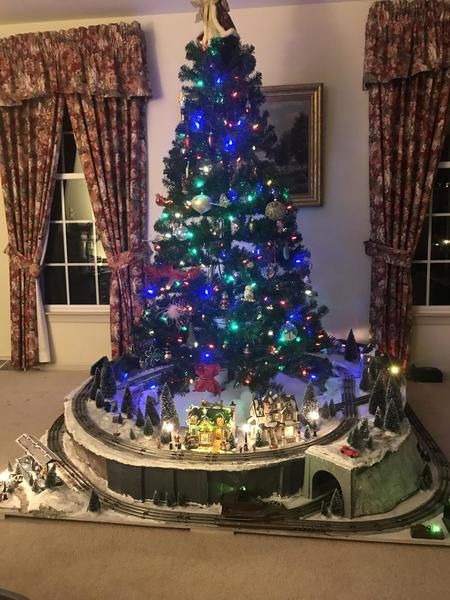 Christmas Train Set Display, Train Set Around Christmas Tree, Christmas Tree Train Platform, Christmas Train Under Tree, Christmas Village Display Under Tree, Christmas Train Around Tree, Train Around Christmas Tree Ideas, Christmas Tree With Train Around It, Christmas Tree Train Ideas