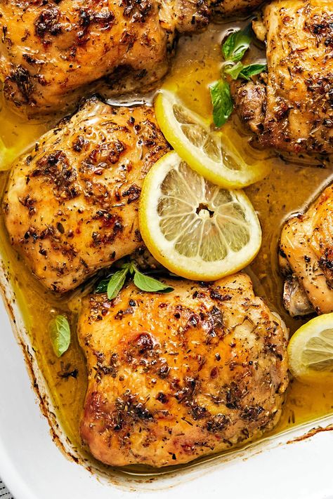 This Greek lemon chicken recipe is the best dinner with juicy, tender, and crisp baked chicken thighs coated in a delicious lemon-herb marinade. Greek Inspired Lemon Chicken Clean Food Crush, Greek Inspired Lemon Chicken, Lemon Barbecue Chicken Southern Living, Bake Lemon Chicken In Oven, Greek Chicken Oven Roasted, Lemon Chicken Crockpot Recipes Healthy, Greek Lemon Garlic Chicken, Fried Lemon Chicken Recipe, Baked Greek Lemon Chicken 12 Tomatoes