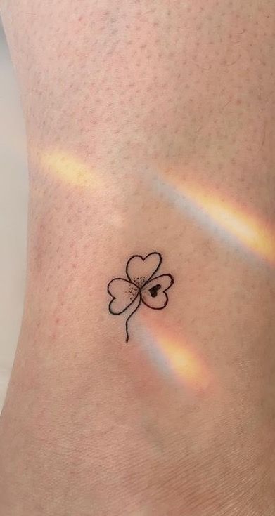 Shamrock Wrist Tattoos For Women, Tiny Irish Tattoos For Women, Shamrock Finger Tattoo, Shamrock Wrist Tattoo, Minimalist Shamrock Tattoo, Small Lucky Tattoos, Clover Ankle Tattoo, Fine Line Shamrock Tattoo, Tattoo Ideas Irish