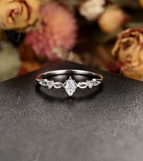 Vintage Moissanite Engagement Ring White Gold Women, Unique Marquise cut Simple Ring, Art deco Bridal set Diamond, Anniversary Gift for her Years of love story: https://www.etsy.com/shop/GemsOdes ◆Detail description◆ ◆Solid 14k White Gold(shown in picture)  ◆Center stone: Moissanite    Shape: 6*3 mm Marquise cut    Side stone: Diamond    Shape: Round cut     Carat: approx 0.054 CT    Color: G-H    Clarity: VS-SI ◆Shank Width:1.2 mm    Shank Thickness:1.2 mm    Total Weight: about 1.55 g    Ring Vintage Moissanite Engagement Ring, Moissanite Engagement Ring White Gold, Marquise Cut Engagement Ring, Cute Engagement Rings, Future Engagement Rings, Promise Ring Gift, Simple Ring, Simple Engagement Rings, Engagement Ring White Gold