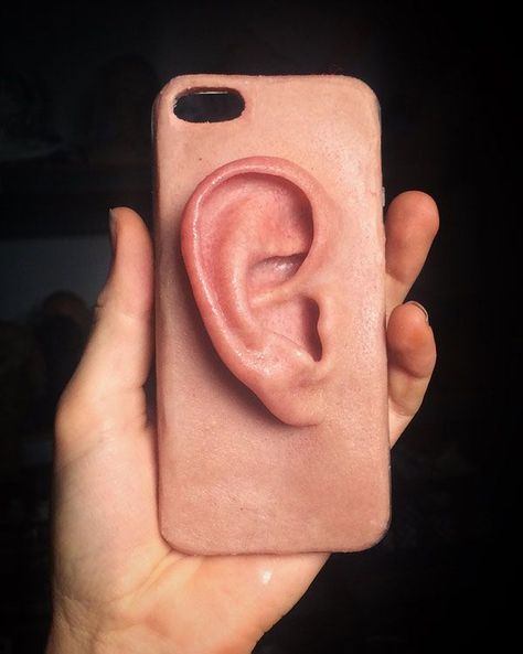 "Can you hear me now?"Artist Sarah Sitkin of Los Angeles specializes in realistic and unsettling sculptures of human body parts. She recently made this cell phone case for Josh, an embroidery artist in Melbourne, Australia. It looks and feels just like a human ear, which is probably handy if you're trying to make a phone call without anyone seeing you.-via Booooooom... Human Ear, Human Body Parts, Blog Art, Juxtapoz Magazine, Iphone Cover, Case Iphone, Clay Art, Clay Crafts, Cell Phone Cases