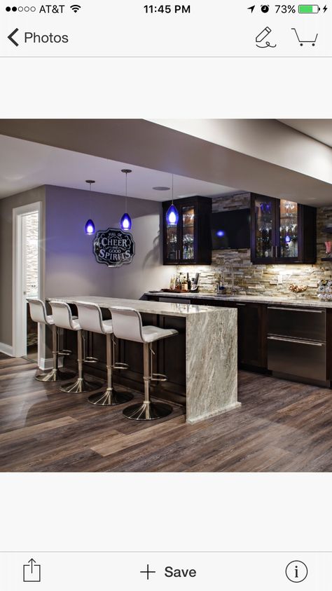 Finished wet bar with waterfall countertop and nice details Wet Bar With Island Basement, Waterfall Island Bar, Wet Bar Island Ideas, Waterfall Bar Countertop, Wet Bar Ideas Basement, Gaming Loft, Waterfall Bar, Basement Wet Bar Ideas, Modern Home Bar Designs