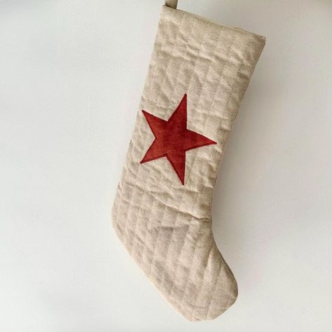 A handmade, quilted christmas stocking just perfect for that special someone or family tradition. All sewn by hand finished with a simple applique star.  Made only from natural fibres and free from plastics using 100% European flax linen with a 100 % unbleached calico lining.  • The star is available in seven different colours which you can select from the drop down menu.  • The size of the stocking is approx 45 x 26 cm with a 5 cm hanging loop Simple Applique, Linen Christmas Stocking, Quilted Christmas Stockings, Christmas Craft Fair, Scandi Boho, Family Tradition, Natural Fibres, European Linens, Family Traditions