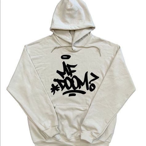 This Is The Mf Doom Hoodie With Mf Doom Graffiti On The Front And Big Madvilliany Mask On The Back On A Sand Colored Hoodie With Black Designs. Mf Doom Graffiti, Doom Graffiti, Black Designs, Teen Swag Outfits, Mf Doom, Shirt Design Inspiration, Sand Color, Swag Outfits, Black Design