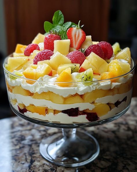 This Mixed Fruit Trifle is always a crowd-pleaser! It’s colorful, delicious, and super easy to make. The layers of fruit and cream create a refreshing treat. Perfect for parties or just because!  For three decades, I’ve been making this trifle! Everyone always asks for the recipe. One scoop, and you're in love! Link in first comment [👇] [👇]  Ingredients: - 2 cups mixed fresh fruits (like berries, bananas, and kiwi) - 1 cup whipped cream - 1 cup sponge cake pieces (or ladyfingers)  For the full recipe details, including additional ingredients, check the link in the first comment [👇] [👇]  #FruitTrifle #DessertLovers #ColorfulDelight #EasyRecipes #FoodieFun Fruit And Cream, Fruit Trifle, Guilt Free Dessert, Peach Slices, Mixed Fruit, Vanilla Pudding, Fresh Fruits, Whipped Topping, Recipe Details