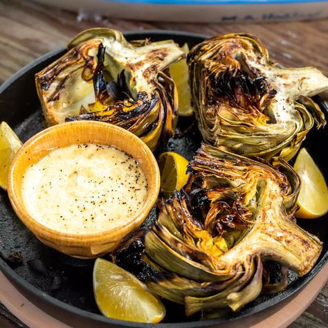 Fire Roasted Artichoke and Lemon Garlic Aioli Recipe | Sur La Table Best Artichoke Recipe, Lemon Garlic Aioli, Roasted Artichokes, Garlic Aioli Recipe, Grilled Artichoke, Roasted Artichoke, Lemon Aioli, Aioli Recipe, Popular Dinner Recipes