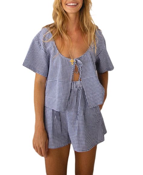 PRICES MAY VARY. Material: Polyester blend. Y2k plaid pajama two piece set, tie front peplum shirts shorts set sleepwear, super soft and skin friendly, breathable, lightweight, comfortable to wear. Feature: Gingham pajamas two piece lounge set, tie front short sleeve peplum shirt, lace up bow babydoll blouse, tie up front cardigan tops, open front bandage, loose fit, bow tie crop top blouses, plaid print pajama shorts, elastic waist wide leg sleep shorts. Style: Peplum shirt and ruffle hem short Lounge Outfits, Bow Shorts, Gingham Shorts, Short Pj Set, Striped Pyjamas, Plaid Pajamas, Front Tie Shirt, Elastic Waist Shorts, Pajama Set Women