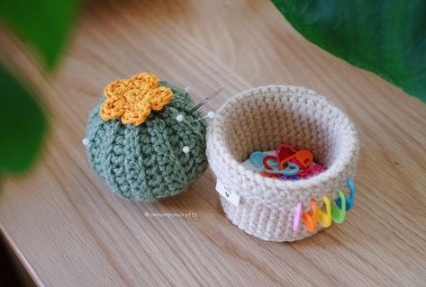 Pom 🌱 Crochet Genshin Friends! on Instagram: "This cactus pin cushion with a secret stitch marker holder is, surprisingly, one of the most useful things I’ve made this year! I’ve been using it for two things: (1) a new Genshin pattern I’m designing (coming soon!!) and (2) sewing! i’m terrible about leaving stitch markers in every nook and cranny, so it’s been super helpful to have a home for them. plus, the pin cushion also keeps my tapestry needles in one place and just makes the perfect hub Crochet Pin Holder Free Pattern, Crochet Sewing Pin Cushion, Pincushion Crochet Free Pattern, Crochet Cactus Pin Cushion Free Pattern, Crochet Cupcake Pin Cushion, Crochet Marker Holder, Crochet Stitch Marker Holder, Crochet Cactus Pin Cushion, Stash Jar Crochet Pattern