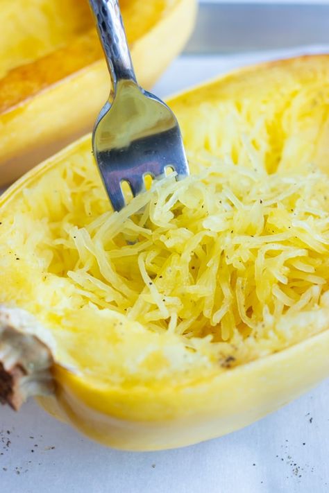 Learn How to Cook Spaghetti Squash by baking it in the oven until it shreds easily into noodles with a fork!  This quick method is a foolproof way to prepare squash so it turns out perfectly roasted and caramelized.  Serve it as a vegetarian and vegan side dish or replace pasta with it for a keto or low-carb dinner! #spaghettisquash #squash #lowcarb #keto #howto Spaghetti Squash Microwave, Garden Squash, Winter Flavors, Cook Spaghetti Squash, Cooking Spaghetti Squash, Food Tutorials, Cooking Spaghetti, Dinner Rotation, Baked Spaghetti Squash