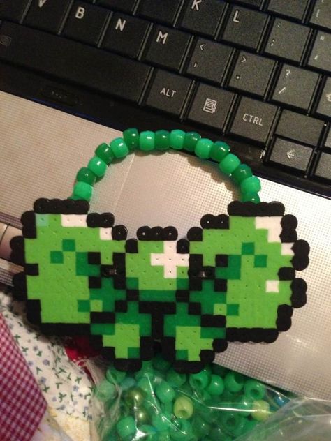 Kandi bow also made with perler beads Perler Accessories, Rave Bracelet, Perler Bead Necklace, Kandi Crafts, Rave Bracelets, Kandi Necklace, Rave Kandi, Perler Designs, Scene Queen