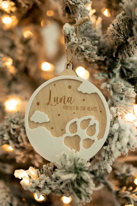 Pets will leave paw prints in our hearts, this ornament will be a great gift to remember them, year after year. A sweet way to honor and remember your fur baby.  Details: Three different styles available for purchase -Wood with White Acrylic Border -Clear Acrylic with White Acrylic Border -Mirror Silver Acrylic with White Acrylic Border Pet Ornaments Memorial, Christmas Ornaments 3d Print, Glowforge Acrylic Projects, Acrylic Laser Projects, Personalized Wood Gifts, Pet Christmas Ornaments, Ornament Photography, Engraver Ideas, Pet Ornaments