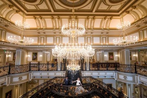 Lakeside manor with three-story ceilings and gold details for large weddings | The Legacy Castle Pequannock Township, NJ Skylight Room, Banquet Hall Wedding, Event Hall, Ballroom Wedding, Castle Wedding, Nj Weddings, Grand Staircase, Stunning Gowns, Banquet Hall