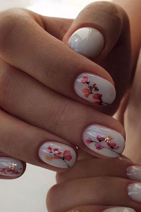 One of the prettiest flower nail designs we’ve seen is this beautiful Japanese-inspired cherry blossom look that sets flecks of gold and fuchsia off on a winter white background. If you don’t think you have the skills to pull off this delicate and intricate design, text a copy to the nail artist at your local salon for inspiration. Blossom Nail Art, Cherry Blossom Nails Art, Blossom Nails, Cherry Blossom Nails, Flower Nail Designs, Flower Nail, Japanese Cherry Blossom, Pull Off, Flower Nails