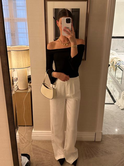 Black off the shoulder top in a size small and ivory trouser pants in a size 2. Summer outfits. London outfits. Work outfits. 4th of July outfit. Travel outfit summer dress.   Follow my shop @maggierussell1 on the @shop.LTK app to shop this post and get my exclusive app-only content!   fashion inspo | fashion outfits | fashion aesthetic | outfit ideas | clothes for women | luxury aesthetic | minimalist | chic | old money aesthetic | coastal granddaughter | vacation outfits | European outfits | clothing pictures | young adult style | blazer outfit | linen outfit | pearls | necklace | revolve | fashion icon | fashion design | clothes design | clean girl aesthetic | fashion blogger | summer day outfit | outfit | summer 2024 fashion | nighttime outfits | elegant outfits | east coast aesthetic Summer Outfits London, Clothing Pictures, Revolve Fashion, London Outfits, Nighttime Outfits, European Outfits, Off The Shoulder Top Outfit, Summer Day Outfits, Young Adult Fashion