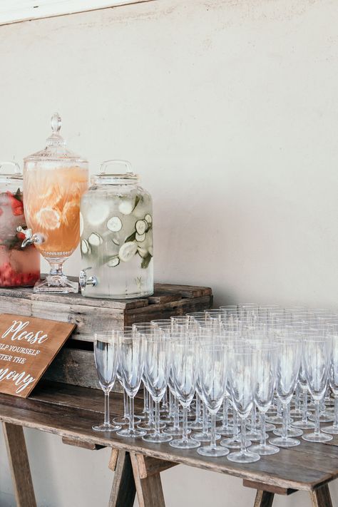 Elevate your wedding reception with a chic Hydration Stations! Choose from a Service Bar or Timber Trestle Table, complete with drink dispensers, glassware, and drink buckets for your alcohol. Cheers to unforgettable celebrations! 🥂💍  Contact HYRE EVENTS to customize your perfect drink station. Visit www.hyreevents.com.au for more details!  #hyreevents #eventrental2024 #furnituregoals #furnitureforrent #eventstyling #eventdecor #luxuryrentals #sydneyevents #sydneyweddings #sydneyfunctions Diy Drink Station Wedding, Elegant Drink Station, Drink Serving Station, Drink Station For Party, Wedding Food Stations Bbq, Drink Set Up For Party Beverage Stations, Selfserve Bar Wedding, Self Service Bar Drink Stations, Wedding Drink Table Ideas