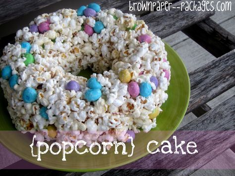 {popcorn cake} I would probably try it with white chocolate instead of marshmallow. Popcorn Cake Recipe, Easter Popcorn, Popcorn Cake, Popcorn Balls, Rice Krispy, Popcorn Recipes, Fruity Pebbles, Mini Eggs, Fun Treats