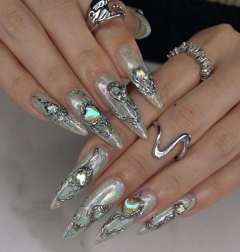 ⛓️ Melted Chrome ⛓️ chrome covered gems are inspired by @vgaoagv jewelry 💚 check out my latest reel to see how shiny this set is as photos don’t do it enough justice 😜 #nails2inspire #3dnails #trendynails #y2k #chromenails #3dchromenails #naildesign #apresgelx #gelxnails #vancouvernails #apresgelx #magnetnails #iridiscentnails #nailsoftheday #longnails Chrome Nails With Gems, Nails With Gems, Y2k Nails, Chrome Nails, 3d Nails, Trendy Nails, Long Nails, Do It, Nail Designs