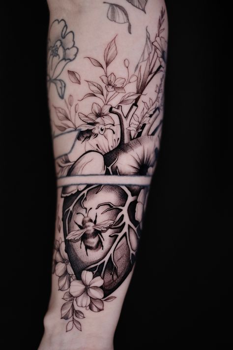 Tattoo on forearm, Anatomical heart with flowers and bees Heart Garden Tattoo, Anatomical Heart And Brain Tattoo, Human Heart Tattoo Designs, Anatomical Brain Tattoo, Heart Sleeve Tattoo, Heart And Brain Scale Tattoo, Anatomical Heart Tattoo With Flowers, Real Heart Tattoos, Human Heart Tattoo