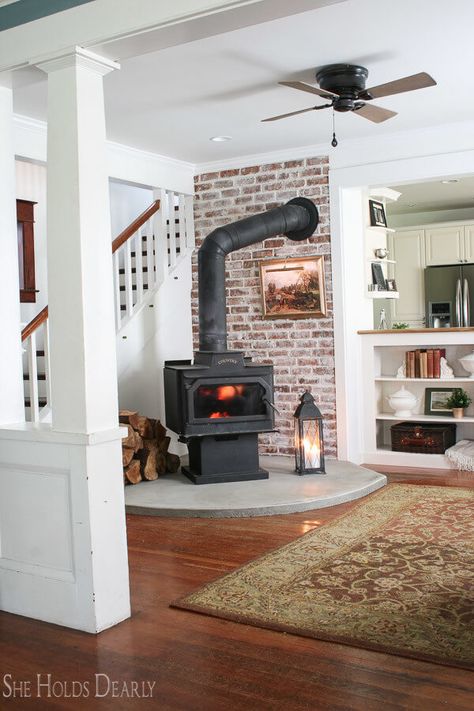 16 Best DIY Corner Fireplace Ideas for a Cozy Living Room in 2019 Built In Shelves Living Room Wood Stove, Wood Stove Backing, Wood Stove In Basement, Wood Stove Built In, Brick Wall Behind Wood Stove, Basement Pellet Stove Ideas, Wood Stove In Corner, Stand Alone Fireplace Living Rooms, Basement Wood Stove