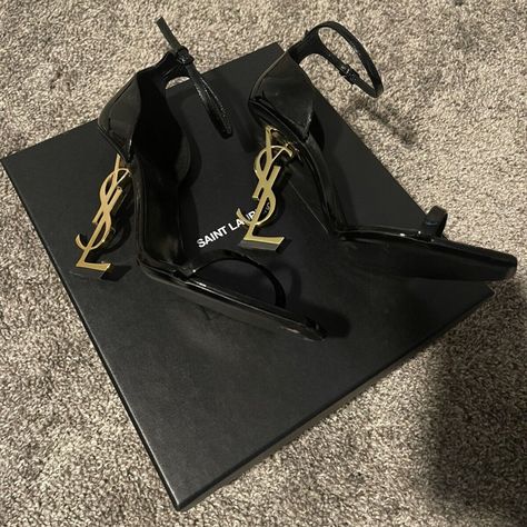 “Ysl” Yves Saint Laurent Black Opyum 110 Sandals Ankle Strap In Patent Leather With Gold-Tone. Preowned Signs Of Wear 2-3 Times Only. Condition Like New. Original Box W/ Dust Bag + Small Envelope. Size: 38.5 Authentic 100% Retail $1,290 Sandals With A Structured Heel Decorated With Metal Ysl Initials And Featuring An Adjustable Ankle Strap. 100% Calfskin Leather Total Heel Height: 11 Cm / 4.3 Inches Leather Sole, Heel In Antique Gold-Toned Metal Style Id 5576620npkk1000 Made In Italy Free Shippi Ysl Store, Shoes Ysl, Small Envelope, Shoes Heels Classy, Ysl Heels, Paint Wall, Yves Saint Laurent Shoes, Vintage Ysl, Dream Outfits