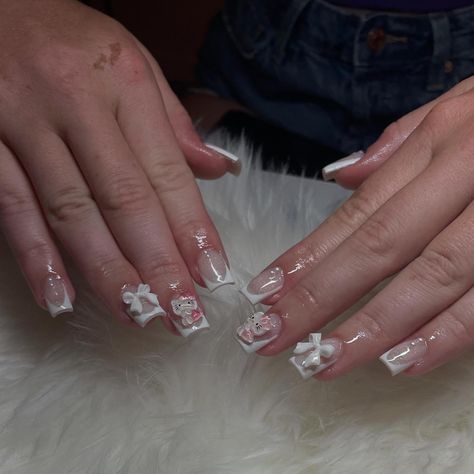 😽🤍🎀 - - - set specifics: • short coffin square • bow & hello kitty charm • french tip • pearls - gel polish: DND gel polish (shade: snow flake) acrylic powder: young nails (shade: cover blush) - #nails #acrylicnails #frenchtipnails #gelpolish #beginnernailtech #bookwithme #manicure #clovis #559 #fresno #shortnails #gel #explorepage #clovisnailtech #summernails #shortnallideas #hellokittynails #birthdaynails Hello Kitty Bow Nails, French Tip Acrylic Nails With Charms, Square Nails Hello Kitty, Hello Kitty Nails Charms, Short Hello Kitty Nails With Charms, Hello Kitty French Tip Nails, Hello Kitty Nails Short, Hello Kitty Charm, Hello Kitty Bow