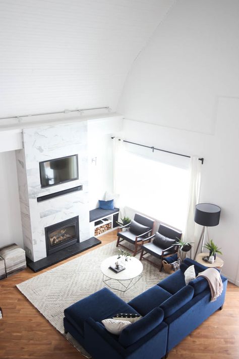 This gorgeous Modern Living Room reveal is finally here! This space came a long way from an outdated, empty space in this beautiful barn home. Love all of the contemporary DIY and decor ideas in this beautiful living space! The tiled fireplace and blue couch are stunning! #bluecouch #livingroom #renovation #diy #blackandwhite #nordic #minimal #modern Blue Couch Living Room, Tiled Fireplace, Blue Couch, Living Room Reveal, Trendy Living Rooms, Living Room Scandinavian, Furniture Couch, Rooms Reveal, Blue Living Room