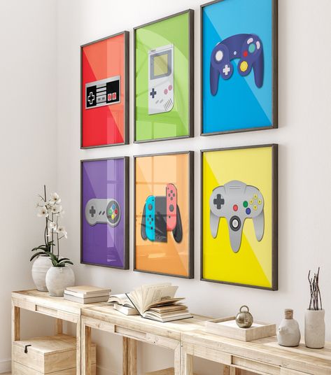 "Hang these Retro controller prints on your walls! *NES and Gamecube are in the same zip folder. other color option,https://megamediadesign.etsy.com/listing/1574073178 Wii instead of Gameboy option available here,  https://megamediadesign.etsy.com/listing/1498802256 Retro video game controller Wall Decor, Digital Prints, Game room poster, Geeky art, Gaming room, set of 6, video games Available to download and print automatically after purchase are 5 zip folders* containing 5 High-resolution 300 dpi, JPG files that are ready to print: *NES and Gamecube are in the same zip folder. RATIO 2:3 4\"x6\" | 8x12\" | 12x18\" | 16x24\" | 20x30\" RATIO 3:4 6\"x8\" | 9x12\" | 12x16\" | 15x20\" | 18x24\" RATIO 4:5 4\"x5\" | 8x10\" | 12x15\" | 16x20\" RATIO 5:7 5\"x7\" | 20\"x28\" BONUS: 11\"x14\" Thank Nintendo Room, Video Game Bedroom, Boys Game Room, Video Game Print, Retro Games Room, Art Geek, Geeky Art, Teen Boy Room, Vintage Video Games