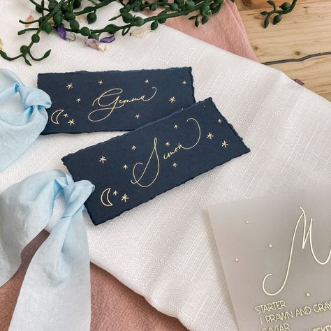 A semi-custom navy and gold moon and stars place name design. Ideal for couples who want to add a celestial vibe to their wedding day. These place names have a deckled edge, which gives an extra dreamy element.  DETAILS Each place name is roughly 100mm x 40mm and uses digital gold foil on navy card, hand finished with a deckled edge.  There is also the option to add faux silk ribbon to each place name. MATCHING ITEMS We have matching on the day items available here: - Navy Menus: https://www.ets Navy And Gold Decor, Baby Shower Place Settings, Astronomy Wedding, Celestial Wedding Invitations, Baby Shower Place Cards, Celestial Wedding Theme, Navy And Gold Wedding, Vintage Astronomy, Starry Night Wedding