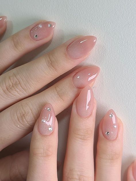 nude ombre almond shaped nails with gems Light Pink Korean Nails, Neutral Nails With Stones, Simple Nails With Stones, Korean Nails Rhinestones, Nail Stone Design Rhinestones Simple, Simple Nail Art With Gems, Pink Stone Nails, Pink Jelly Almond Nails, Natural Looking Nail Designs