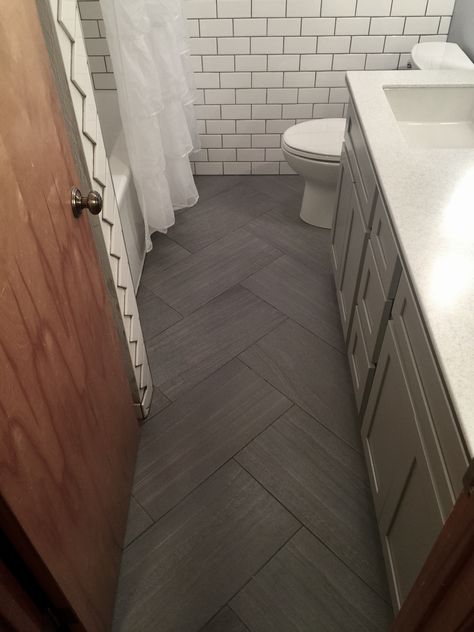 Bathroom Flooring Ideas Herringbone, Dark Gray Herringbone Tile Floor, Small Bathroom Herringbone Tile, Hexagon And Herringbone Tile Bathroom, Charcoal Grey Tile Bathroom, Grey Rectangle Tile Bathroom, Herringbone Tile Floor Bedroom, Small Bathroom Pattern Tile Floor, Small Bathroom Dark Tile