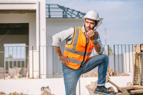 Premium Photo | Portrait of confident caucasian man construction worker wearing hardhat and safety equipment and using walkie talky for work , civil engineers foreman working at construction site. Building Pictures, Civil Engineering Design, Safety Equipment, Construction Worker, Construction Site, Engineering Design, Civil Engineering, Premium Photo, Hard Hats