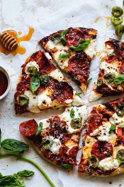 This Pepperoni Pizza with Hot Honey, Ricotta, Olives, and Basil is my favorite pizza combination as of late! It's a little spicy, a little sweet, creamy from the dollops of ricotta and mozzarella, and fresh from the basil! It uses my favorite 00 flour Neapolitan style pizza dough. Bonus points if you have a pizza oven, but you can also make this in a super hot oven! #pizza #pepperoni #hothoney #neopolitan #00flour #ooni Honey Pepperoni Pizza, Pizza With Hot Honey, Neapolitan Pizza Dough Recipe, Honey Ricotta, Honey Pizza, Hot Honey, Pizza Pie, Pizza Recipes Homemade, Pizza Recipes Dough