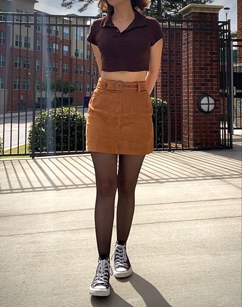 Fall Aesthetic outfit. Black converse with tights, orange-ish brown suede skirt with brown collared crop top. Black Top Brown Skirt, Brown Skirt With Black Tights, Brown Skirt Summer Outfit, Brown Courdory Skirt Outfits, Brown Courdory Skirt Outfit, Converse With Tights, Short Brown Skirt Outfit, Brown Skirt Outfit Aesthetic, Brown Corduroy Skirt Outfit