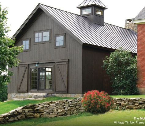 The manufacturer of the metal roof is Ideal and the color is matte black. More Metal Shop Houses, Farmhouse Exterior Colors, Building A Pole Barn, Metal Building Designs, Timber Frame Barn, Farmhouse Exterior Design, Barn Living, Rustic Exterior, Barn Design