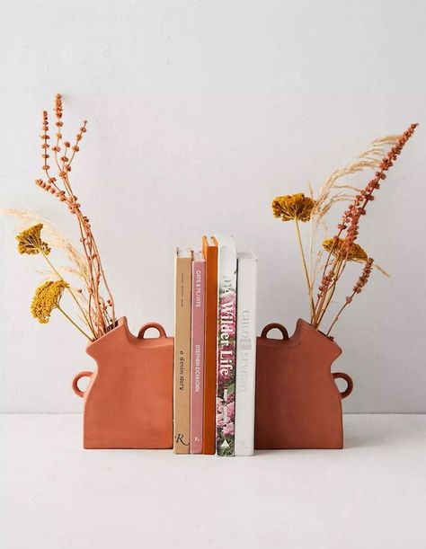 With these terracotta Vase Bookends, add florals to your bookshelves without compromising functionality. Available in a set of two. | Source: Urban Outfitters Cerámica Ideas, Keramik Design, Pottery Crafts, Pottery Classes, Ceramics Pottery Art, Ceramics Projects, Ceramics Ideas Pottery, Vase Design, Clay Ceramics