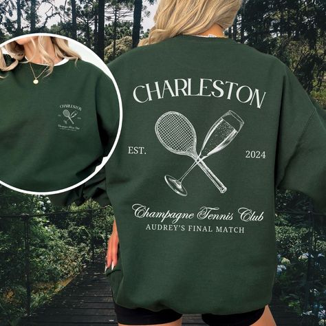 Make your bachelorette party or wedding unforgettable with our Custom Champagne Tennis Club Crewneck! 🎾🏌️♀️ Personalize it with your last name, location, and wedding date for a touch of luxury inspired by a classic country club aesthetic. 💍 This luxury wedding merch features a customized tennis racket and champagne glass logo with your last name or location, and event date, featuring text "Champagne Tennis Club" and optional space for final line, like match made in heaven, bride's final swing Polo Country Club Aesthetic, Retro Country Club Aesthetic, Country Club Sweatshirt, Country Club Merch, Aesthetic Merch Ideas, Vintage Tennis Aesthetic, Country Club Fashion, Tennis Bachelorette, Tennis Club Logo