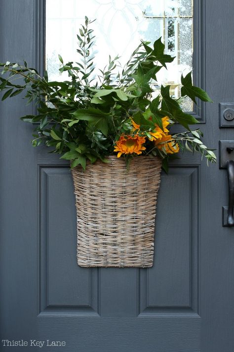 Willow Basket Door Arrangement For Early Fall - If you looking for an easy way to decorate a door or an entry wall this is it and just in time for fall. #falldoordecor #fallwreath #doordecoration #doorbasketarrangement #willowbasketarrangement Fall Door Basket Ideas, Front Door Basket Ideas, Front Door Baskets With Flowers, Fall Door Basket, Decorate A Door, Wreath Decorating Ideas, Door Baskets, Front Door Baskets, Basket Arrangement