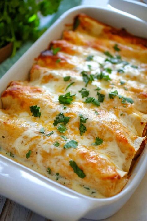 Chicken Enchiladas with Sour Cream White Sauce Sour Cream Burritos, Chicken Enchilada Roll Ups, Chicken Enchiladas With White Sauce, White Enchiladas, Sourcream Chicken Enchiladas, Chicken Enchiladas With Sour Cream, Casseroles Chicken, White Sauce Enchiladas, Soft Flour Tortillas