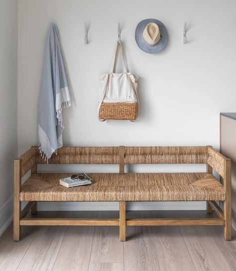 Welcome to Lake Life: this charming sea grass bench from Pottery Barn sits at the entry of a sprawling outdoor deck over-looking the lake. Above, a row of wall hooks offers a practical solution for keeping outdoor essentials organized. From coats to hats, beach bags to books, each item finds its place ensuring a clutter-free entryway. Swipe ⬅️ for the before and after Designed by @burlingtondesignstudio • • • • • #lakehouse #waterfrontwonder #seagrassbench #coastalinteriors #neutraldecor #l... Beach Mudroom, Mudroom Powder Room, Woven Bench, Bench Bedroom, Hats Beach, Small Entryways, Organic Bath Products, Entertaining Essentials, Bedroom Bench