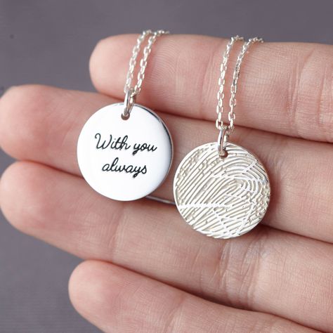 "** CIRCLE PENDANT FINGERPRINT NECKLACE, available in sterling silver, with silver, 18k gold plated or 18k rose gold plated finish. This necklace can be engraved with the fingerprints of your loved ones. We can work with any photo of the fingerprint on paper that is no special kit required. Engravable on the back of the pendant with 1 word or date on the back of the necklace. I T E M ∙ D E T A I L S * Material: Sterling silver * Word limits: 3-4 words or a date on the back * By default, the engr Fingerprint Jewelry Memorial, Thumbprint Jewelry, Thumbprint Necklace, Hair Keepsake, Remembrance Necklaces, Fingerprint Necklace, Fingerprint Jewelry, Cary Nc, Printed Jewelry