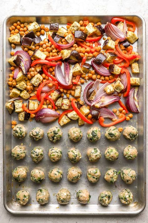 This Sheet Pan Greek Meatballs recipe is a one-dish meal that the whole family will love! This recipe features lemon and herb chicken meatballs accompanied by a blend of perfectly seasoned roasted veggies and chickpeas. Meatball And Roasted Veggies, Sheet Pan Greek Meatballs, Meatball Sheet Pan, Lemon And Herb Chicken, Greek Meatballs Recipe, Greek Meatballs, Tummy Yummy, Herb Chicken, Meatballs Recipe